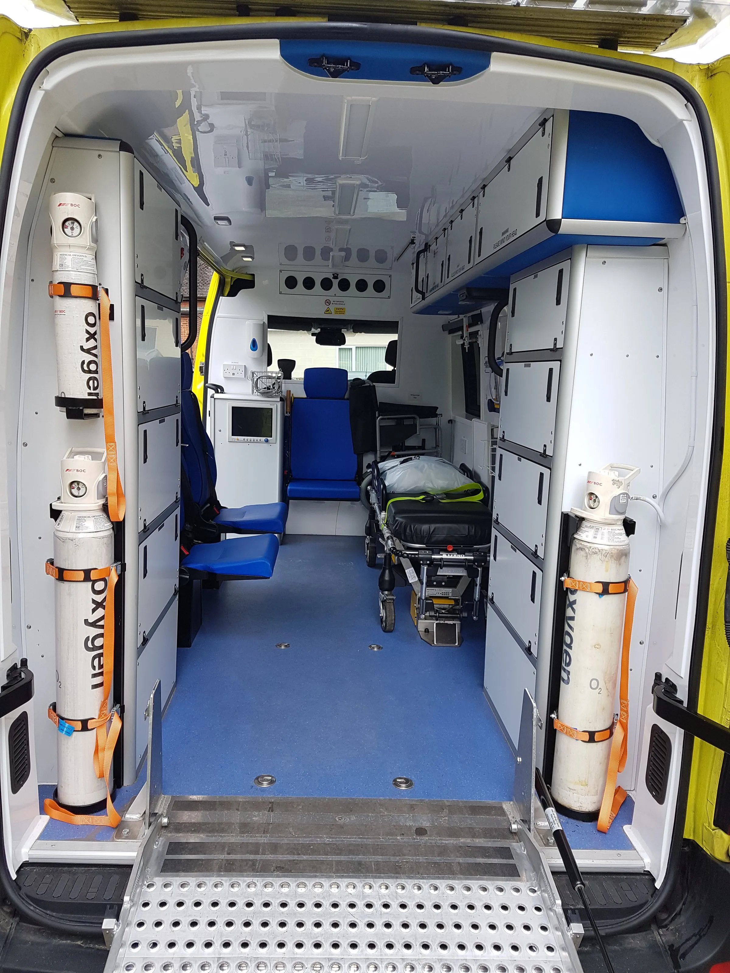 The inside of a Hearts First ambulance showing a stretcher, monitoring equipment and oxygen