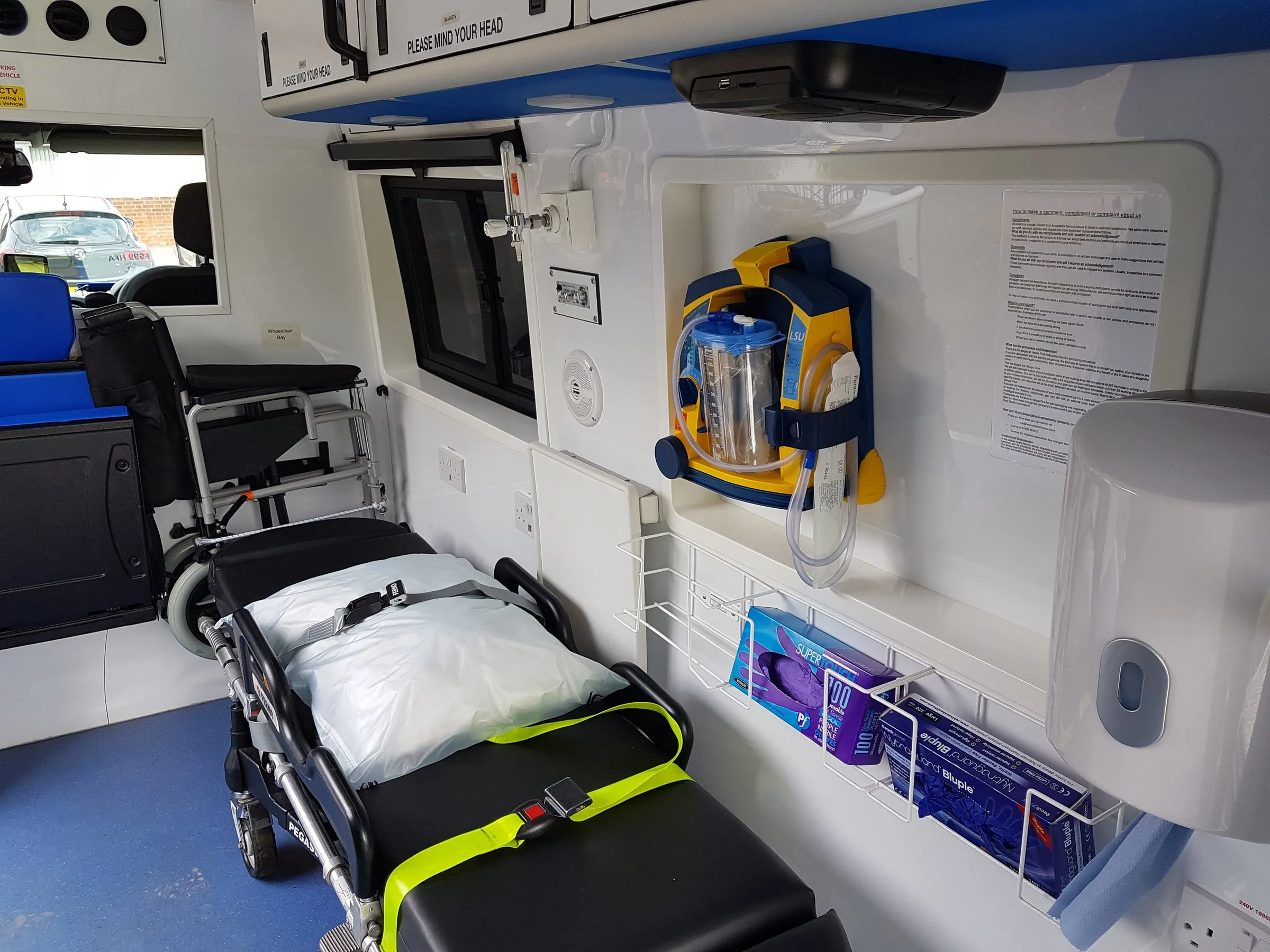 The inside of a Hearts First ambulance showing a stretcher, monitoring equipment and oxygen